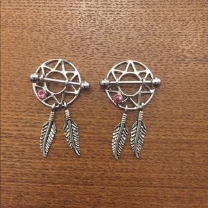 Never worn pair of nipple rings